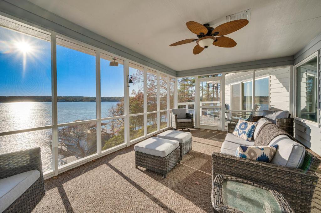 a living room with a view of the water at Waterfront Lake Tillery Home with Incredible Views! in Mount Gilead