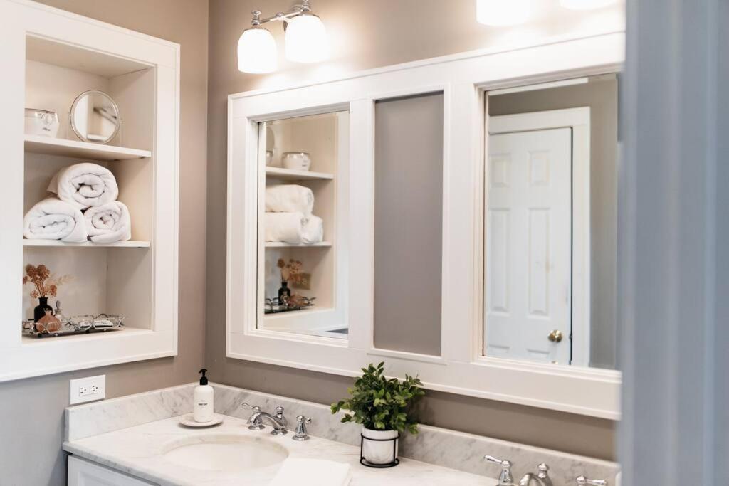 a bathroom with a sink and a mirror and towels at Cottage with Pond at Hidden Creek Estates in Roscoe