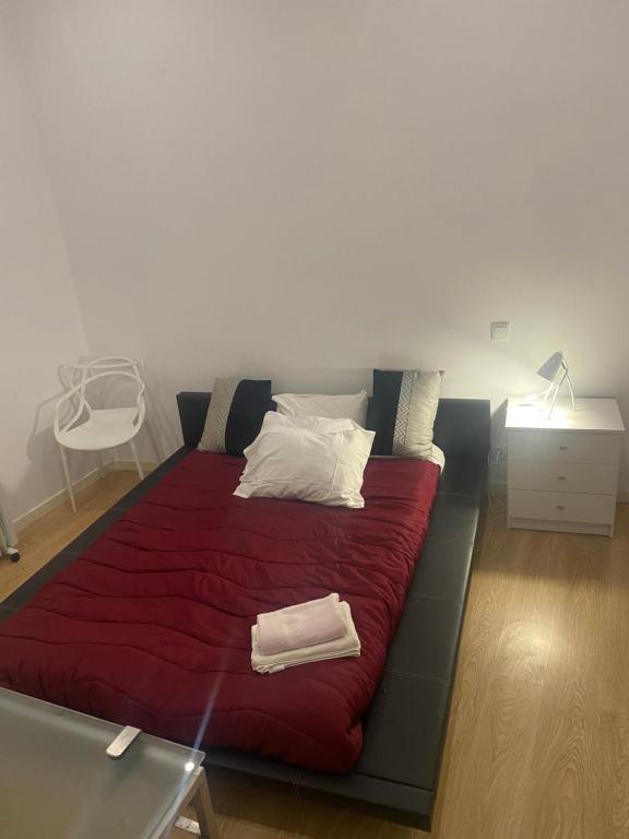Ένα ή περισσότερα κρεβάτια σε δωμάτιο στο Rua visconde de luz 100