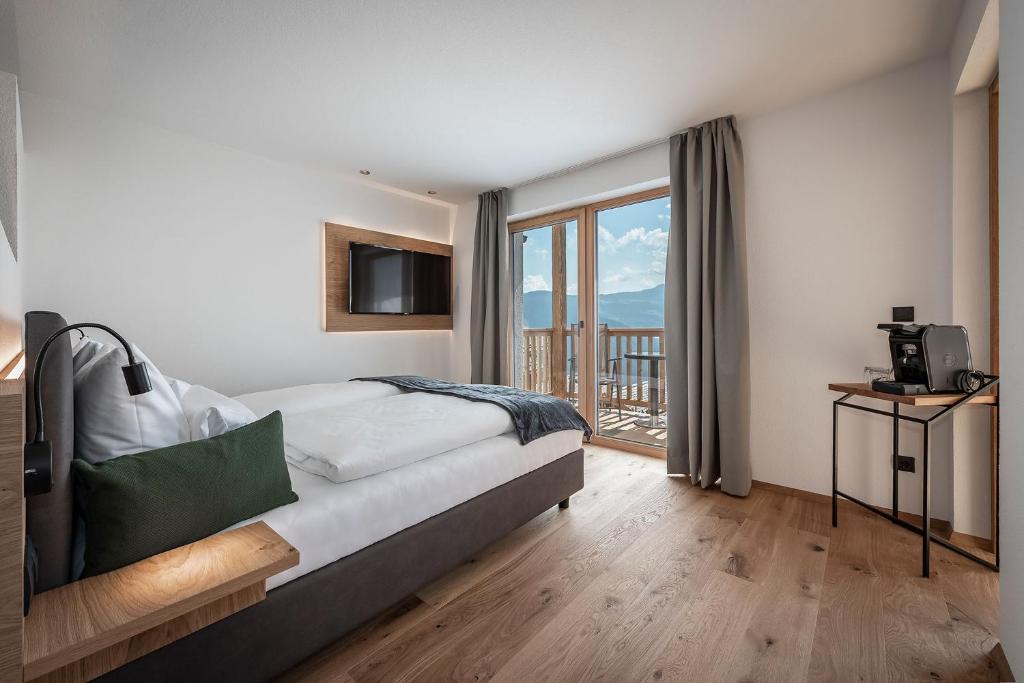Postel nebo postele na pokoji v ubytování DILIA Chalets & Apartments