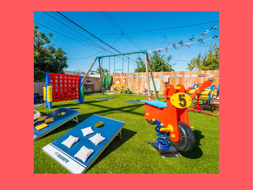 a playground with several different types of playground equipment at Safari Adventure: Arcade, Golf, Playground, Cars & More! in Garden Grove