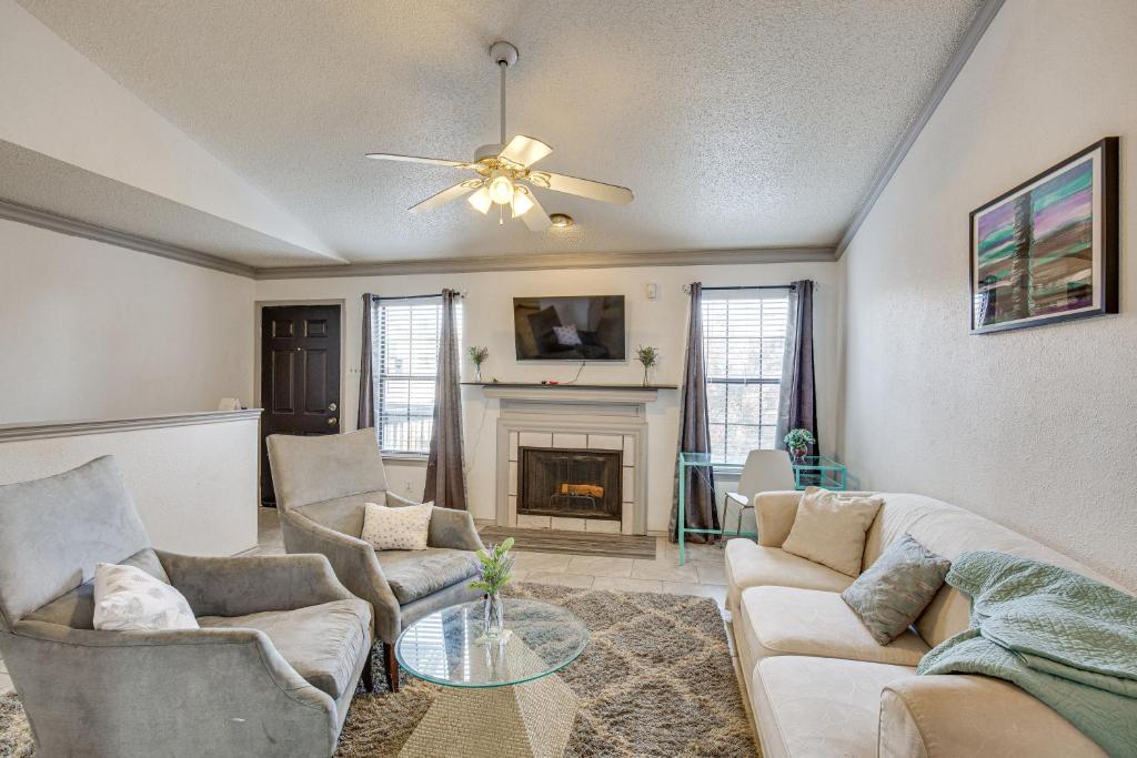 a living room with two couches and a fireplace at Inviting Dallas Condo Less Than 2 Mi to NorthPark! in Dallas