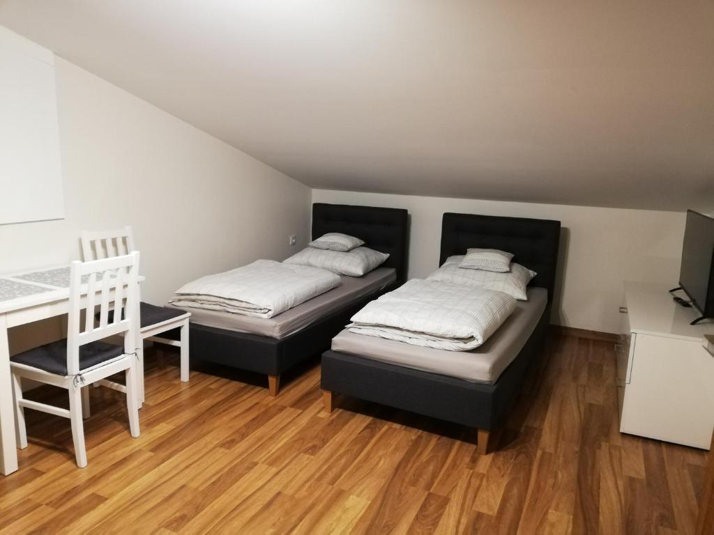 מיטה או מיטות בחדר ב-Olszynowy Gaj V