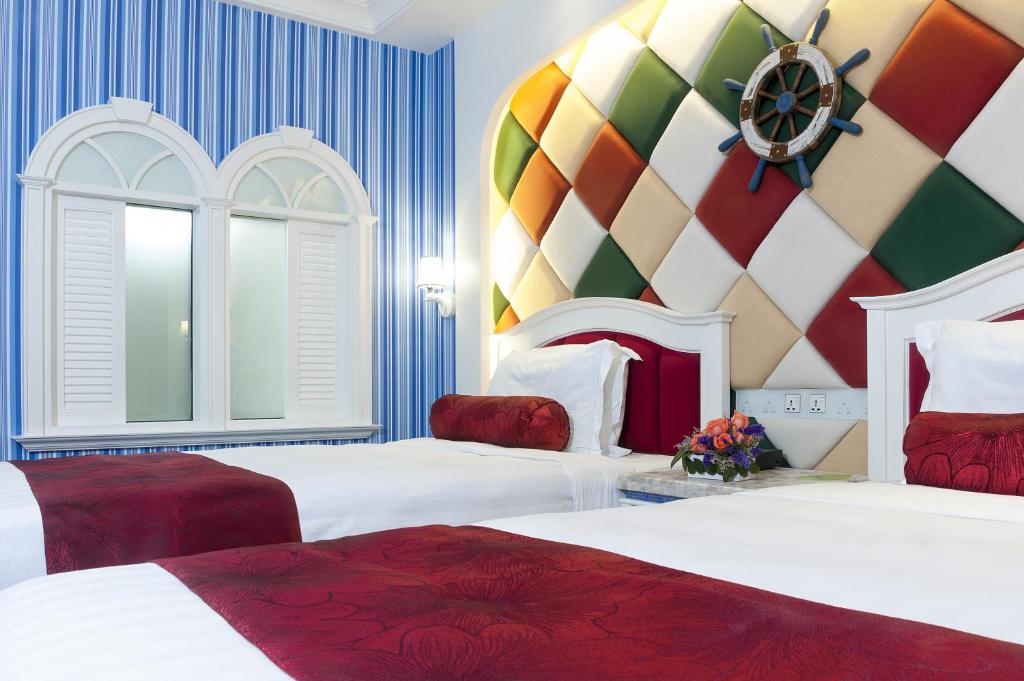 Postel nebo postele na pokoji v ubytování Hotel Beverly Plaza