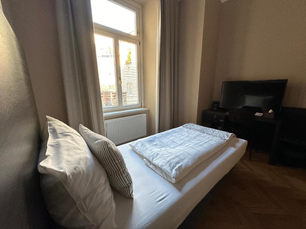Postel nebo postele na pokoji v ubytování Hotel Brauhof Wien