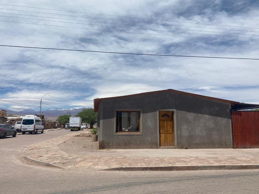 a small building on the side of a street at Xperience Hostel in San Pedro de Atacama