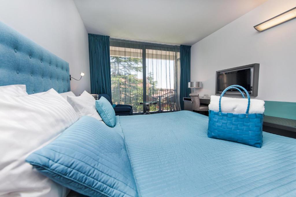 Кровать или кровати в номере Hotel Arupinum