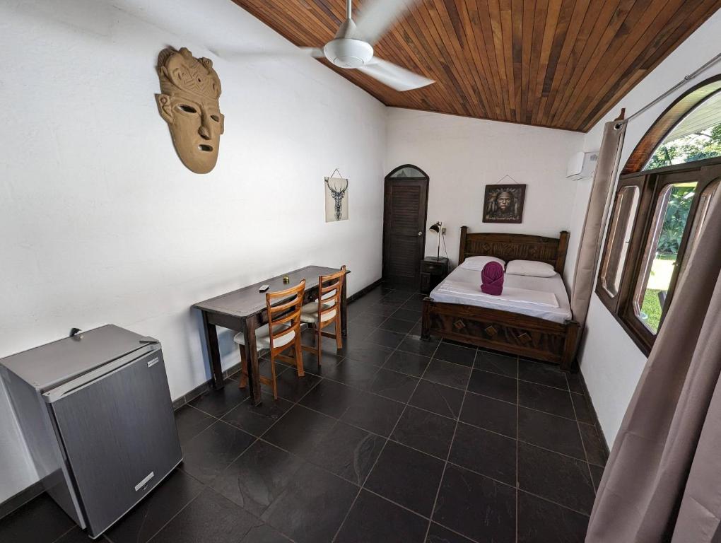 Postel nebo postele na pokoji v ubytování spirit of jungle lodge