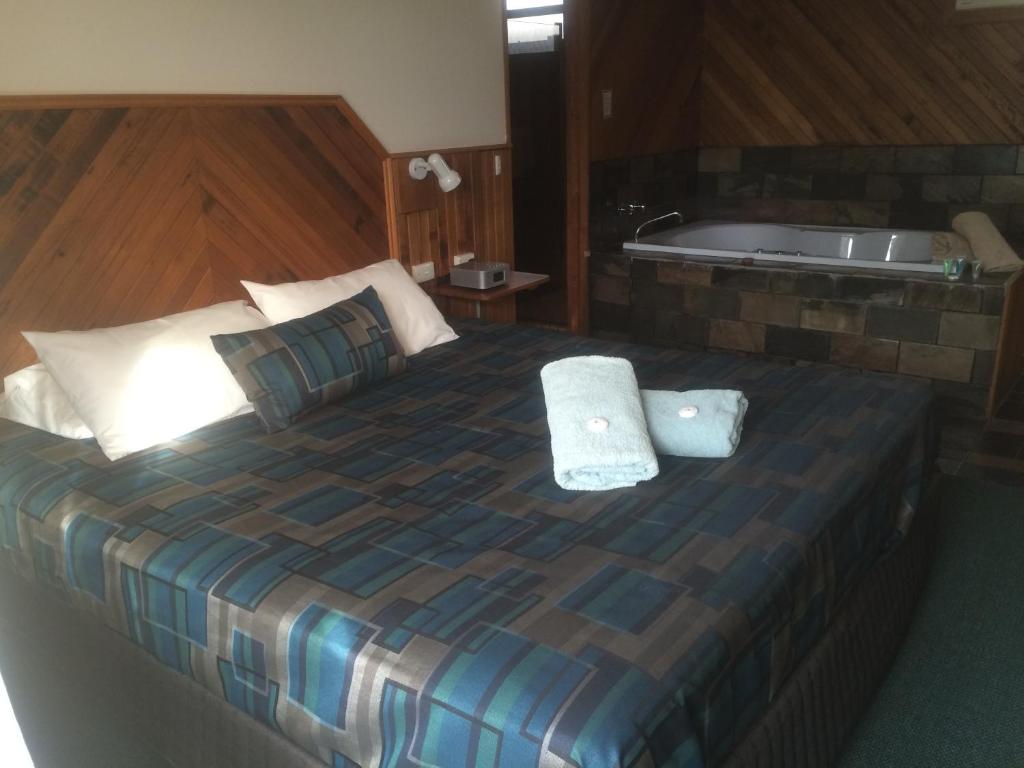 Postel nebo postele na pokoji v ubytování Pelicans Motel San Remo