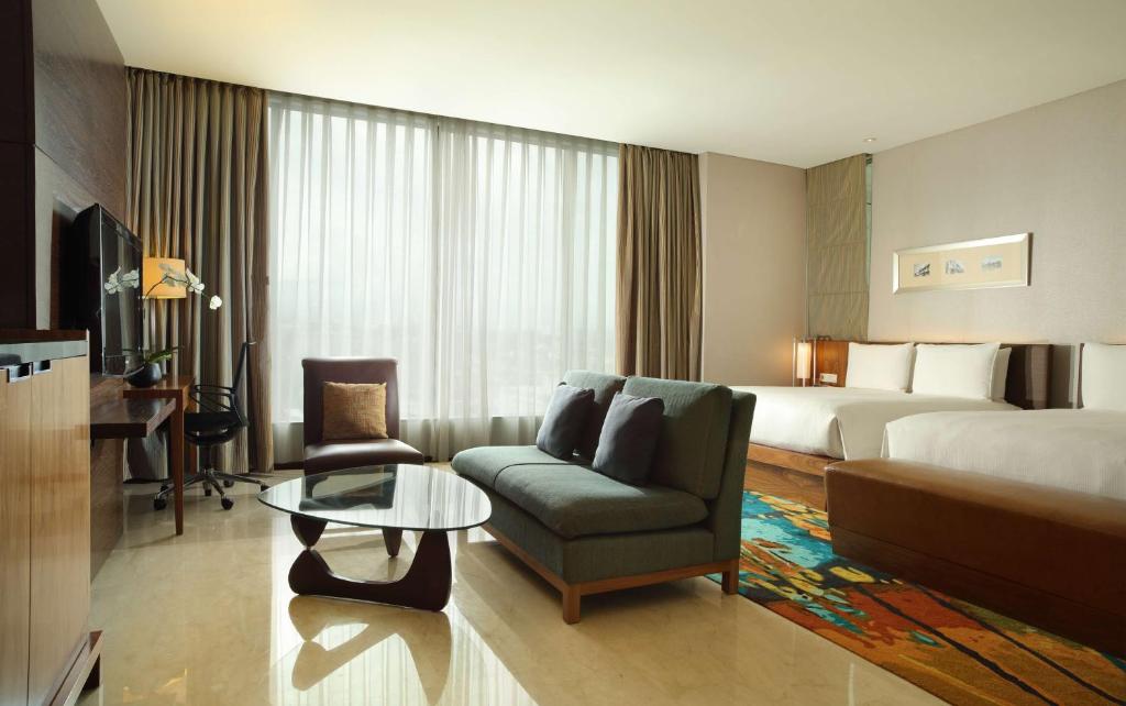 Postel nebo postele na pokoji v ubytování Hilton Bandung