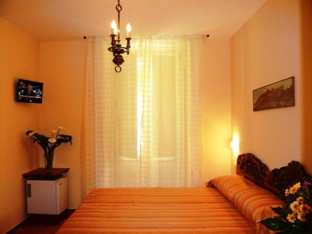Postel nebo postele na pokoji v ubytování DolceVitaSorrento Guest House