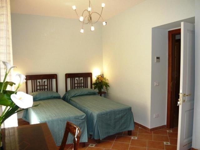 Postel nebo postele na pokoji v ubytování DolceVitaSorrento Guest House