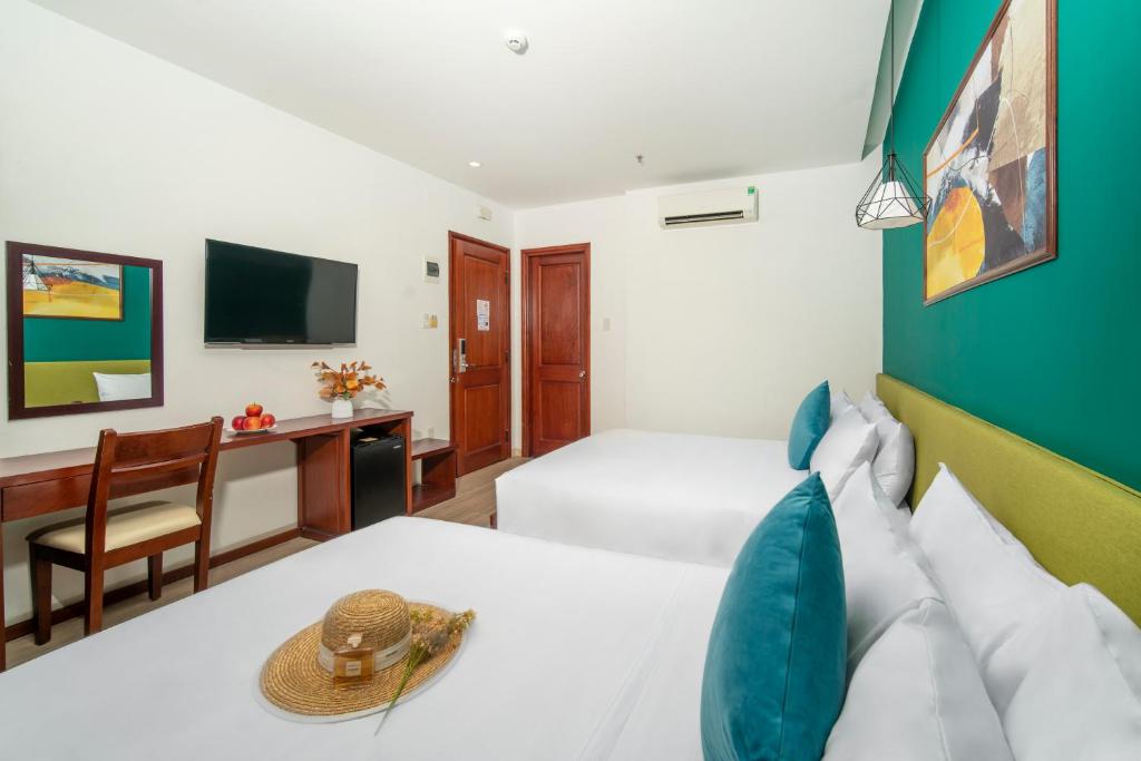 Postel nebo postele na pokoji v ubytování May Beach Hotel