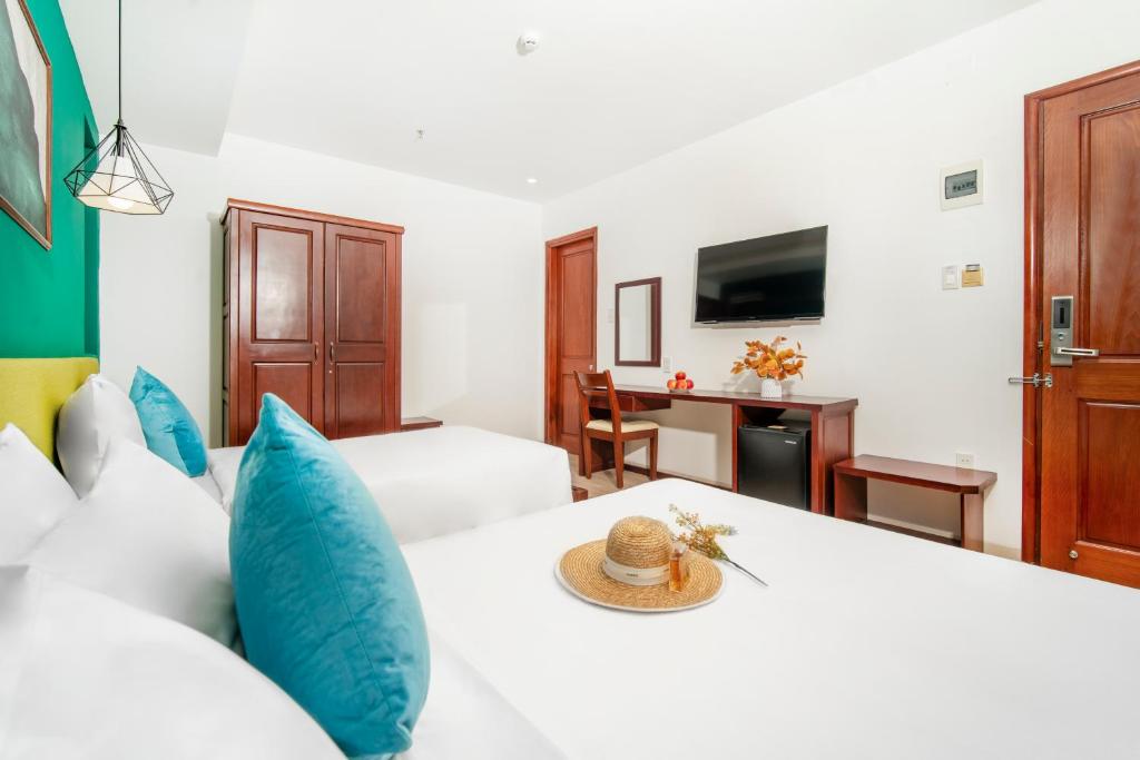 Postel nebo postele na pokoji v ubytování May Beach Hotel