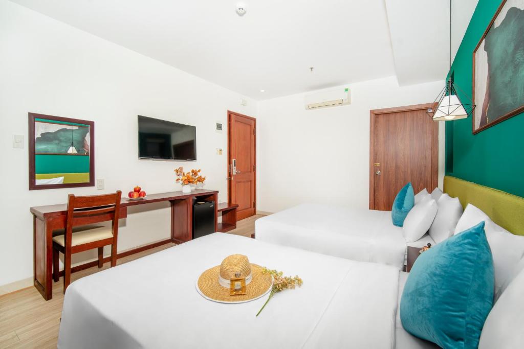 Postel nebo postele na pokoji v ubytování May Beach Hotel