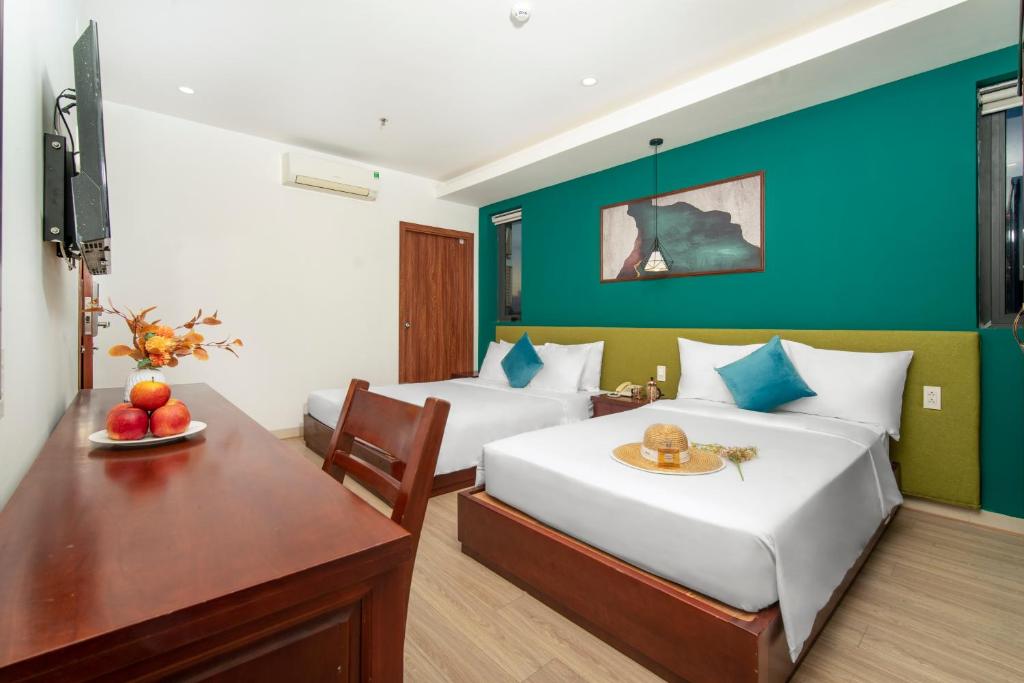 Postel nebo postele na pokoji v ubytování May Beach Hotel