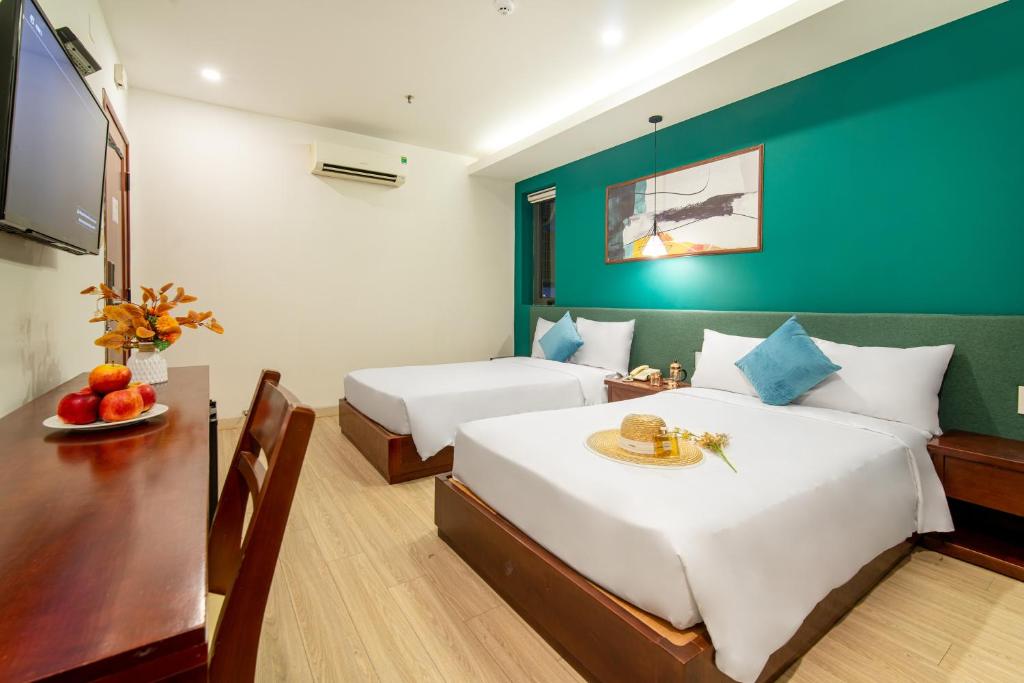 Postel nebo postele na pokoji v ubytování May Beach Hotel