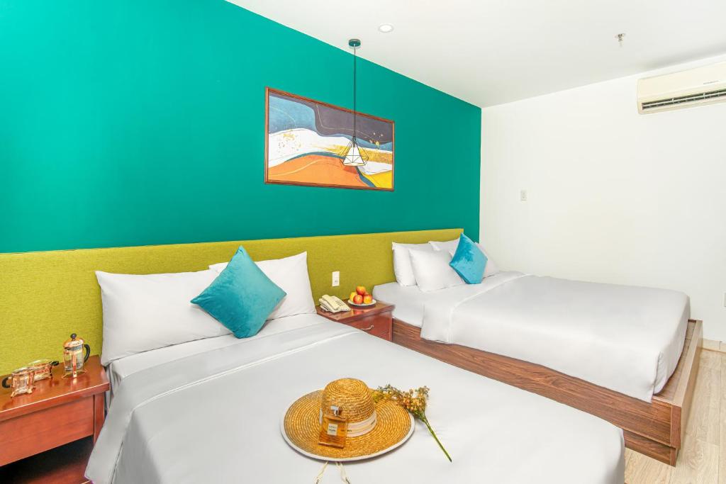 Postel nebo postele na pokoji v ubytování May Beach Hotel
