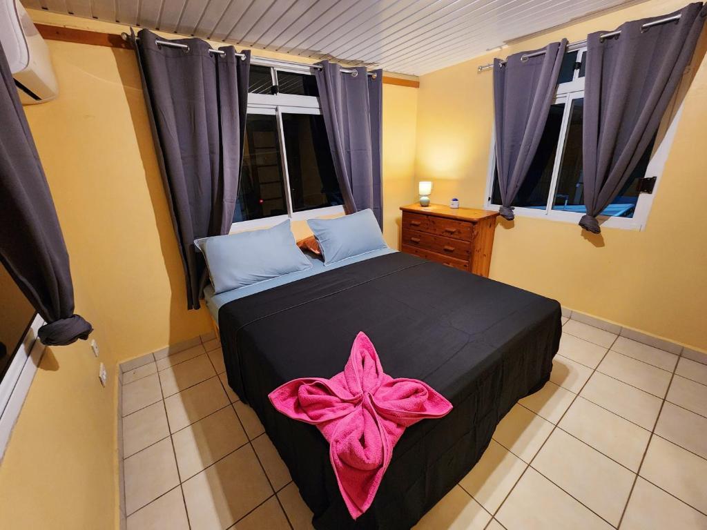 Postel nebo postele na pokoji v ubytování Fare Moana Bord de Mer Fare Tepua Lodge