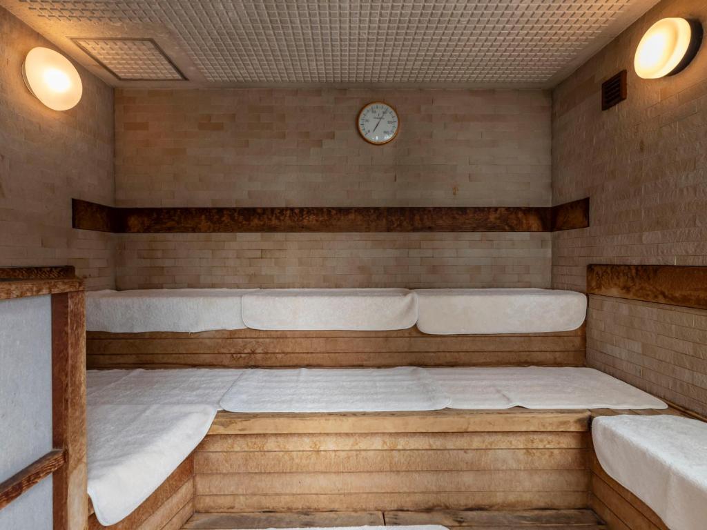 Postel nebo postele na pokoji v ubytování Tennenonsen Harunonoyu
