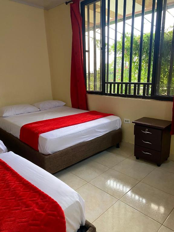 Postel nebo postele na pokoji v ubytování Hotel Casa campestre HH