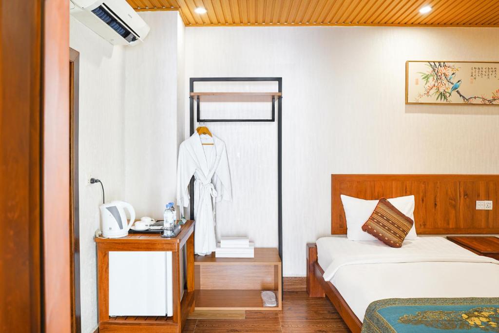 Postel nebo postele na pokoji v ubytování Phuminh Hotel Riverside