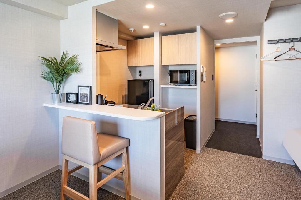 Kuchyň nebo kuchyňský kout v ubytování Apartment Hotel 11 Shinsaibashi 3