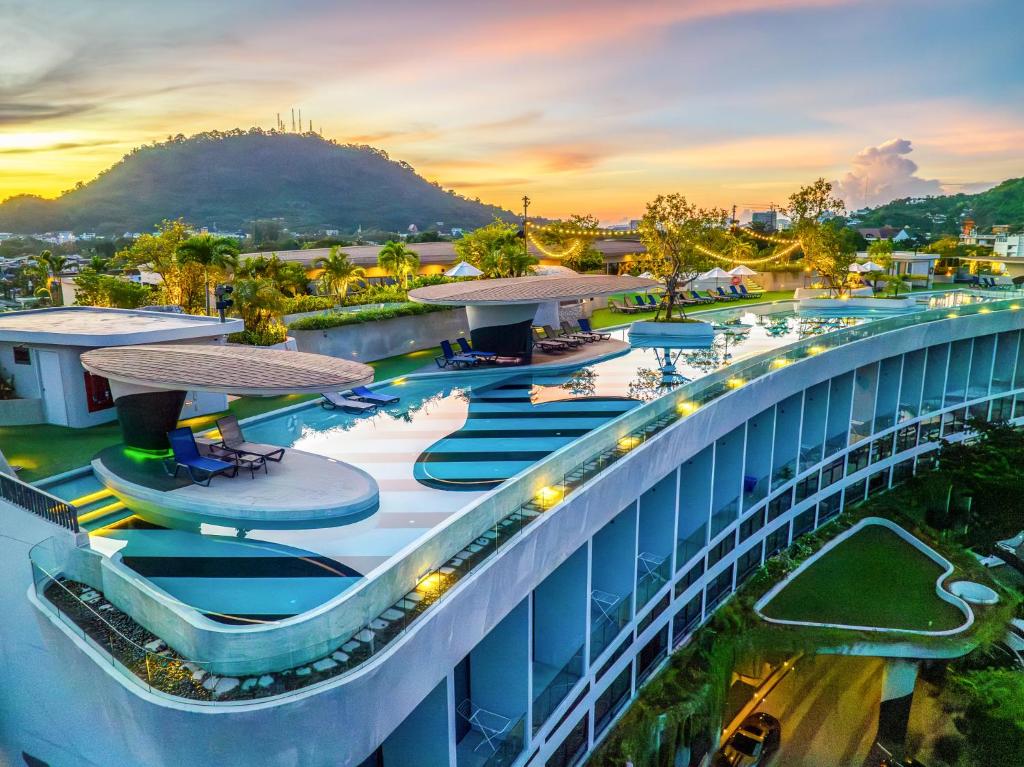 an aerial view of a building with a pool at HOMA Phuket Town in Phuket Town