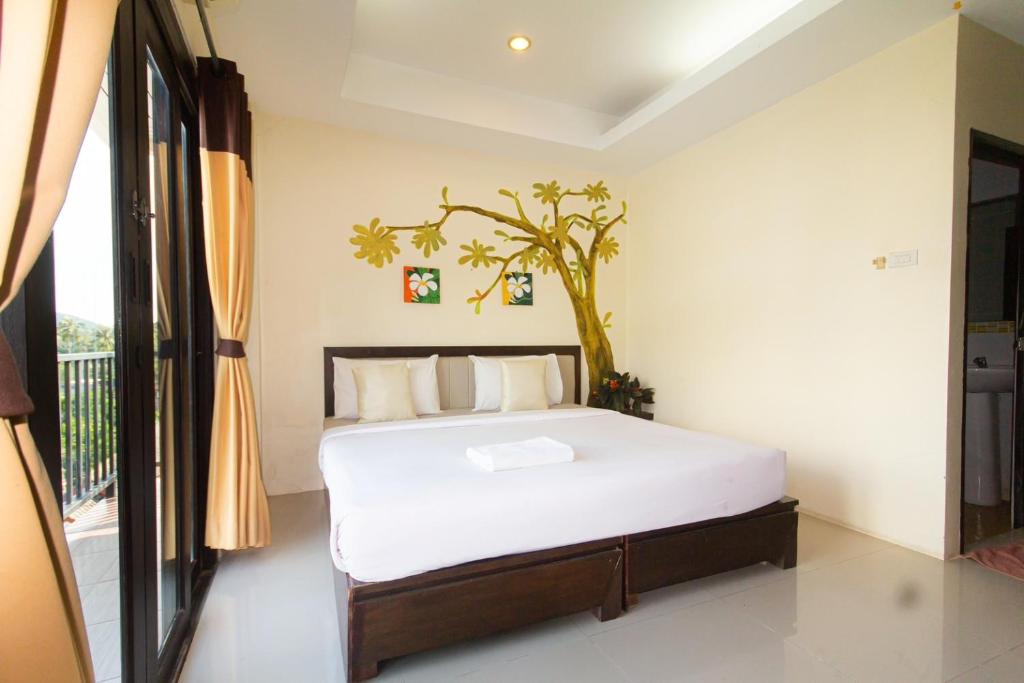 Postel nebo postele na pokoji v ubytování KRABI MORE HOTEL