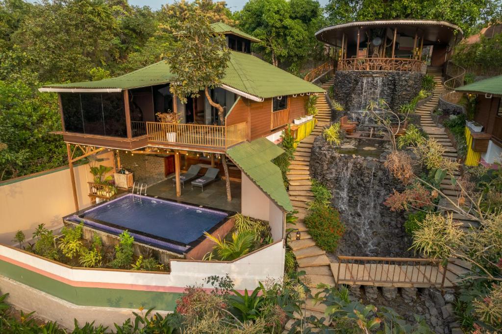 an aerial view of a house with a waterfall at Simroseate in Agonda