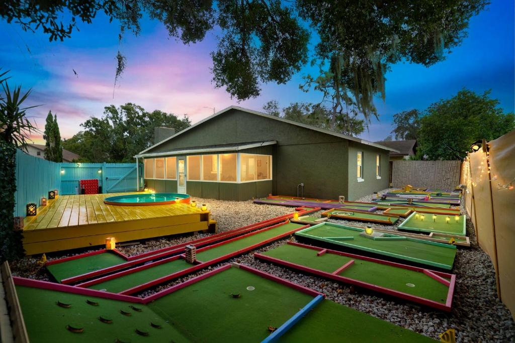 a group of trampoline parks in front of a building at Groovy Winter Haven Getaway - 4 bdrm near Legoland in Winter Haven