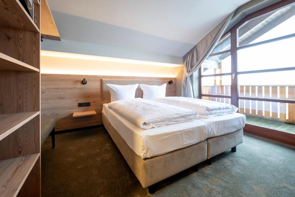 Postel nebo postele na pokoji v ubytování Hotel Berghof