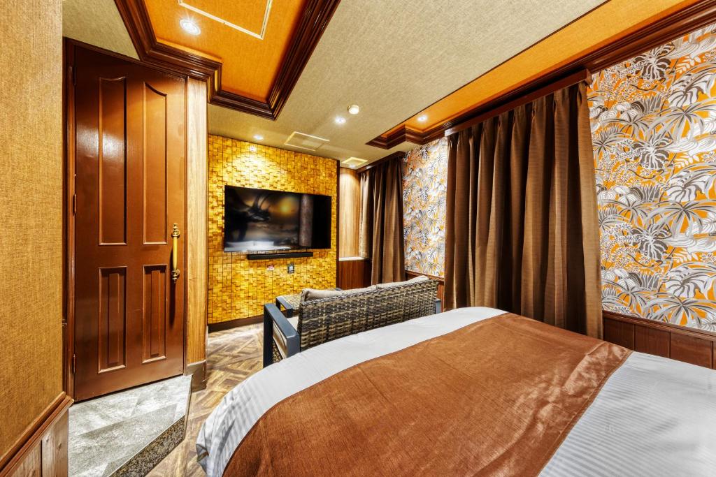Postel nebo postele na pokoji v ubytování Hotel Artia Dinosaur hirakata -Adult Only