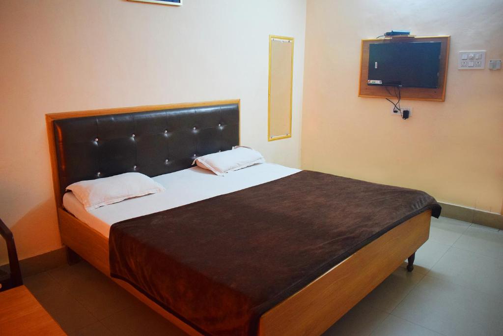 Postel nebo postele na pokoji v ubytování Hotel Golden