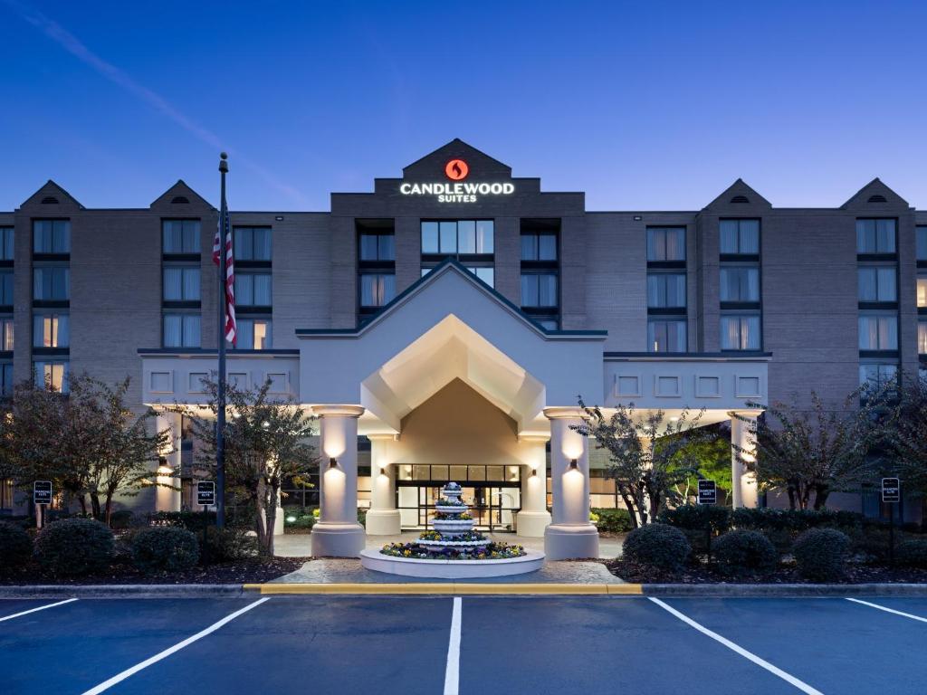 an exterior view of a hotel with a parking lot at Candlewood Suites - Birmingham - Inverness, an IHG Hotel in Birmingham