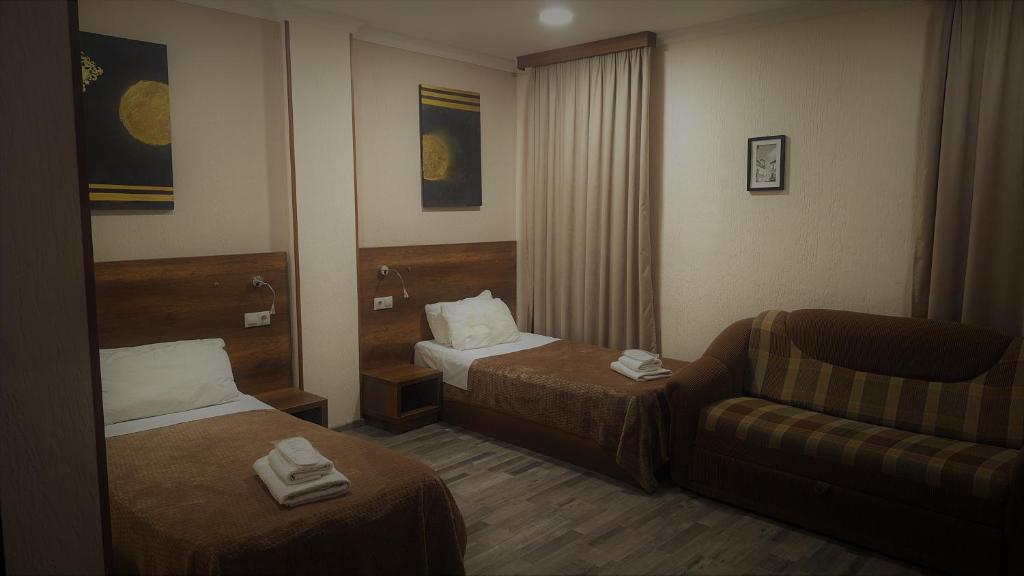 Postel nebo postele na pokoji v ubytování Hotel Georgian