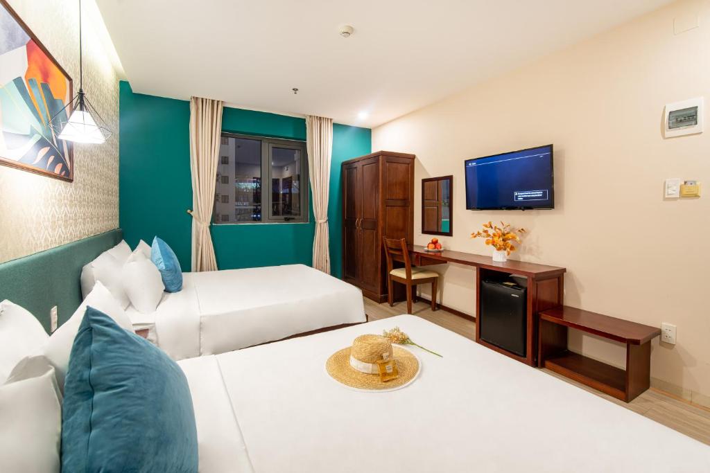 Postel nebo postele na pokoji v ubytování May Beach Hotel