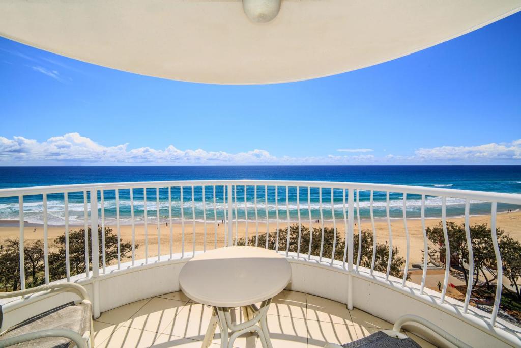 a balcony with a view of the beach at Olympus Beachfront Apartments in Gold Coast