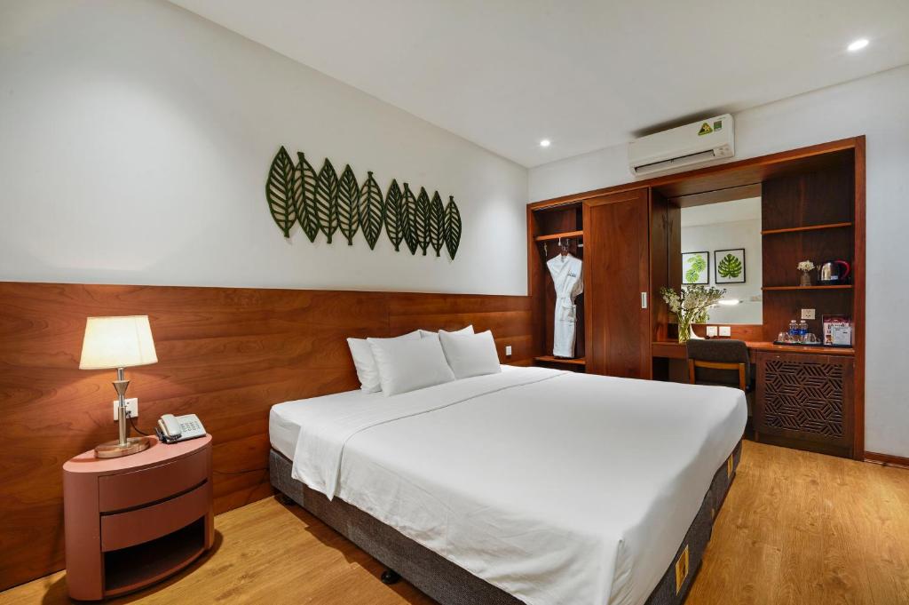Postel nebo postele na pokoji v ubytování 22Land Classic Suites