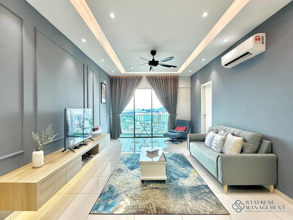 a living room with a couch and a tv at Melaka Ong Kim Wee Residences by Stayrene in Melaka