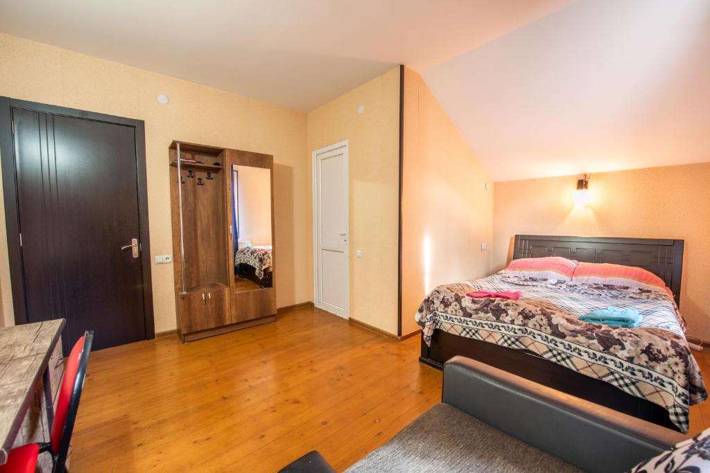 Postel nebo postele na pokoji v ubytování Guesthouse Mtskheta-Kapanadze