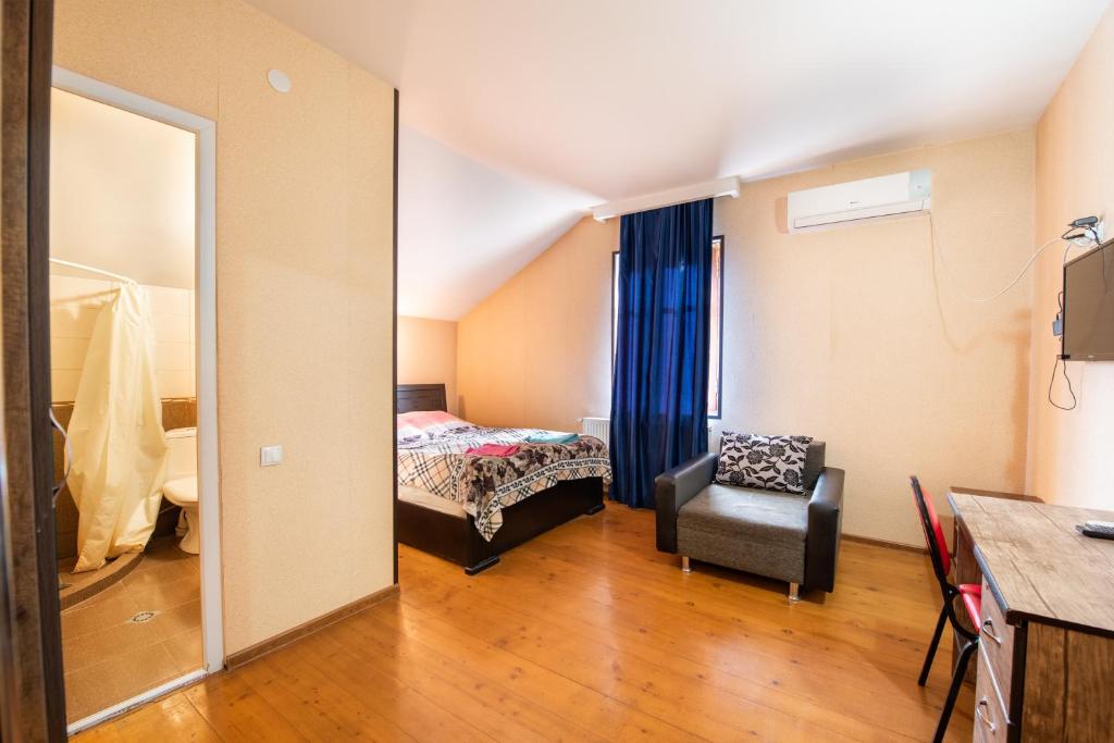 Postel nebo postele na pokoji v ubytování Guesthouse Mtskheta-Kapanadze