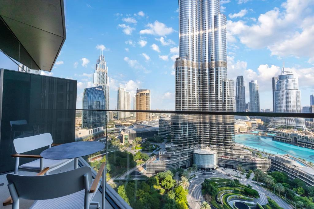 a view of a city from the balcony of a skyscraper at FAM Living - Burj Khalifa Bliss: Address Opera Modern 2BR in Dubai