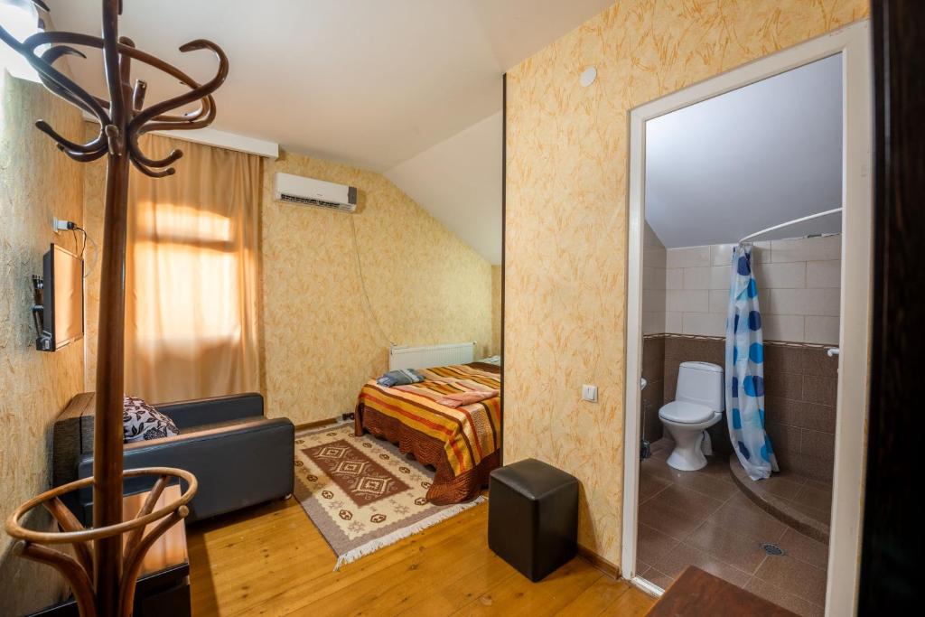 Postel nebo postele na pokoji v ubytování Guesthouse Mtskheta-Kapanadze