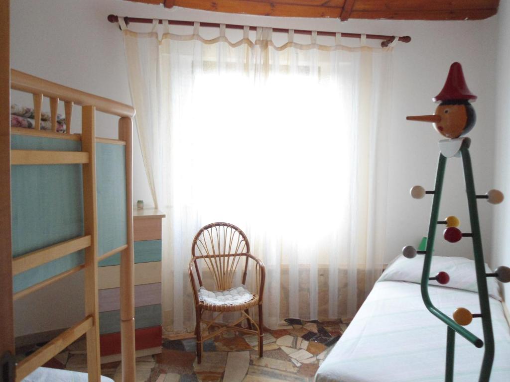 a bedroom with a christmas tree in front of a window at Ville Alba & Azzurra in Polignano a Mare