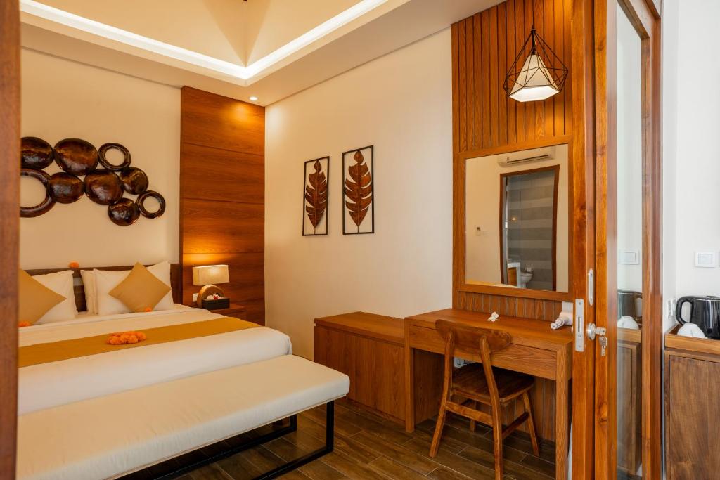 Postel nebo postele na pokoji v ubytování Freddies Resort & Villas Ubud by Kanaya Hospitality