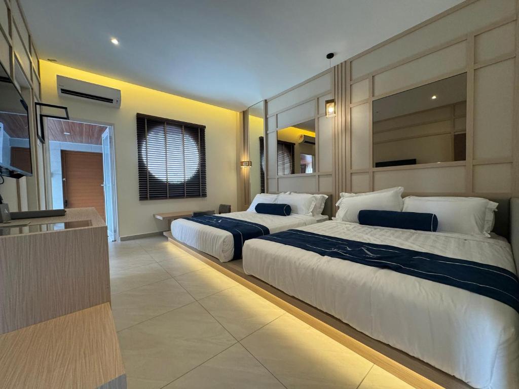 Muzi Boutique Hotel - 阳台的四倍房间