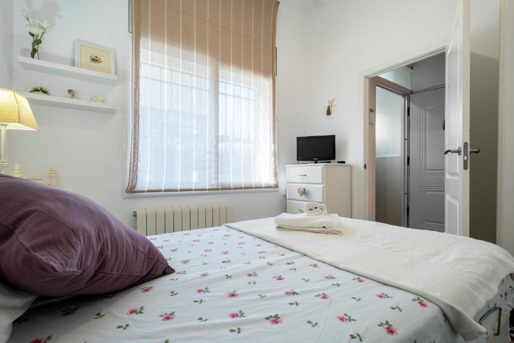 Posteľ alebo postele v izbe v ubytovaní Hauzify I Casa d'Anselm Clavé