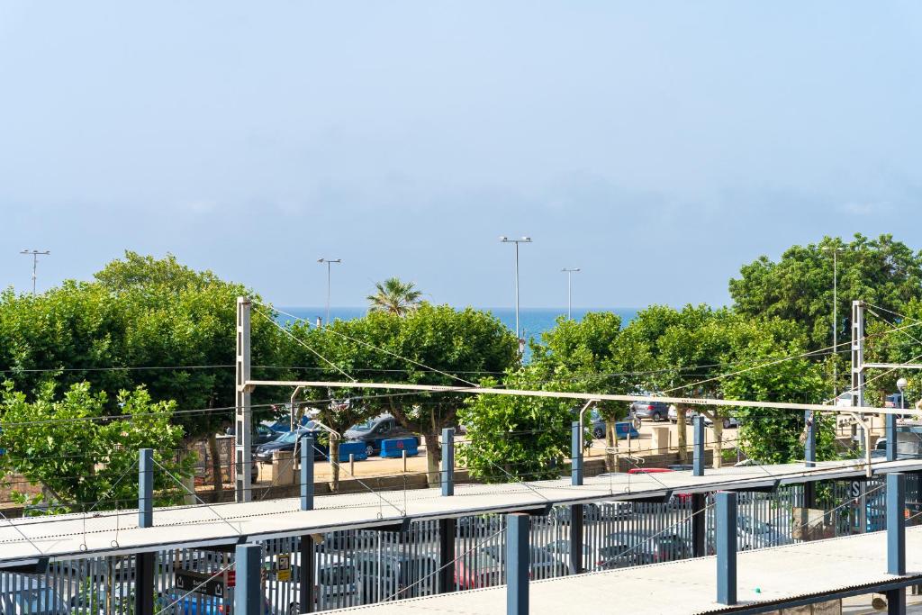 a playground with a roller coaster in a park at Hauzify I Casa d'Anselm Clavé in Calella