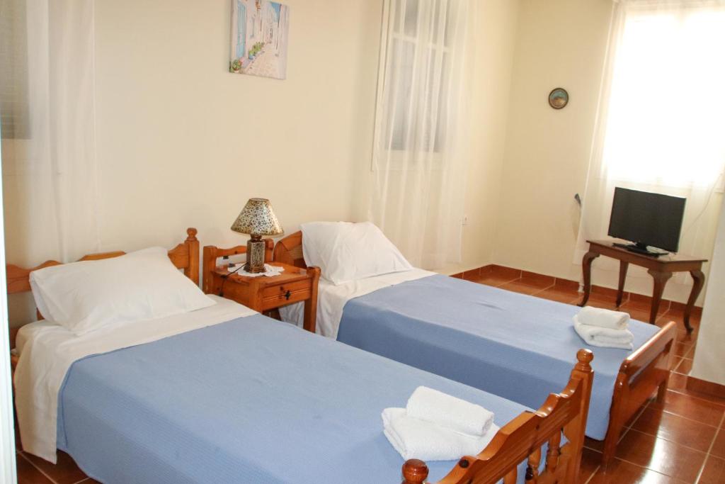 Postel nebo postele na pokoji v ubytování Ellis Apartments